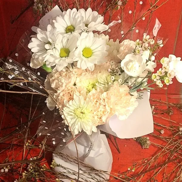Aromatic bouquet with fragrant seasonal stems wrapped for delivery