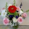 Local Cincinnati florist delivery bouquet with roses, daisies, gerbera blooms, and seasonal accents in a glass vase.