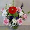 Local Cincinnati florist delivery bouquet with roses, daisies, gerbera blooms, and seasonal accents in a glass vase.