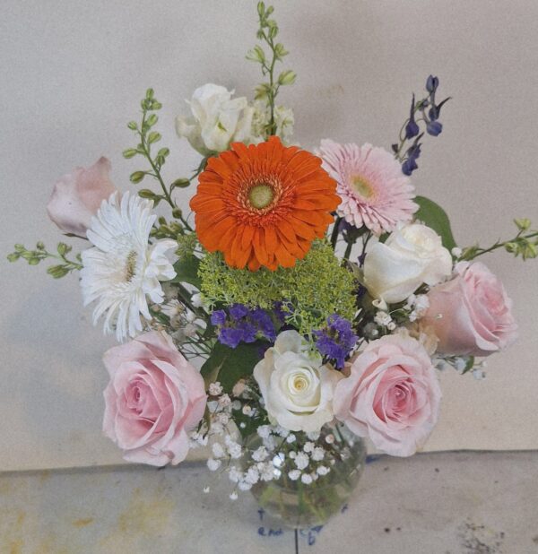 Local Cincinnati florist delivery bouquet with roses, daisies, gerbera blooms, and seasonal accents in a glass vase.