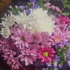 Radiant Garden Charm bouquet with white chrysanthemum, pink daisies, purple asters, and lush greenery