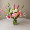 Closer Than Stars Closer Than Stars bouquet featuring roses, lilies, chrysanthemums, billy balls, and larkspurs in a clear glass vase, symbolizing freshness, secure delivery, and heartfelt storytelling across Cincinnati neighborhoods