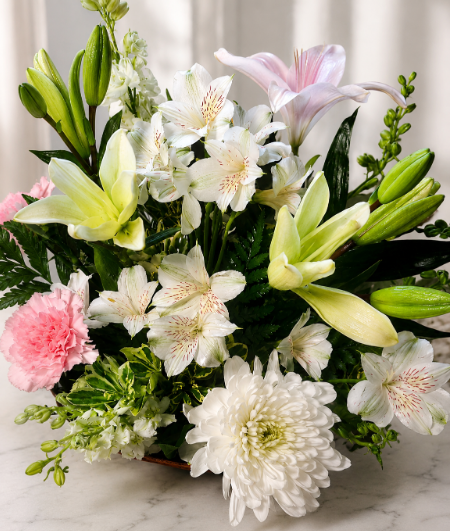 Fresh bouquet of white chrysanthemums, pink lilies, yellow lilies, alstroemeria, and carnations with lush greenery, arranged for fast flower delivery in Cincinnati neighborhoods.