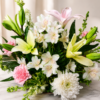 Fresh bouquet of white chrysanthemums, pink lilies, yellow lilies, alstroemeria, and carnations with lush greenery, arranged for fast flower delivery in Cincinnati neighborhoods.