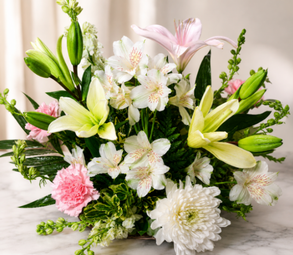 Fresh bouquet of white chrysanthemums, pink lilies, yellow lilies, alstroemeria, and carnations with lush greenery, arranged for fast flower delivery in Cincinnati neighborhoods.