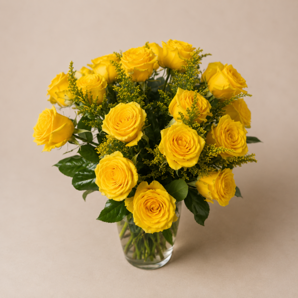 Bright Yellow Rose Bouquet In A Vase Bright yellow rose bouquet in a clear glass vase with greenery and solidago filler flowers.
