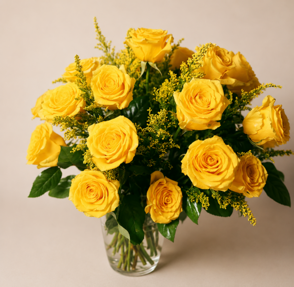 Bright Yellow Rose Bouquet In A Vase Bright yellow rose bouquet in a clear glass vase with greenery and solidago filler flowers.