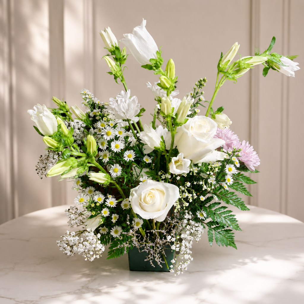 Handcrafted bouquet of premium roses and lilies by Local Cincinnati Florist at allthepeoplesflowers.com.