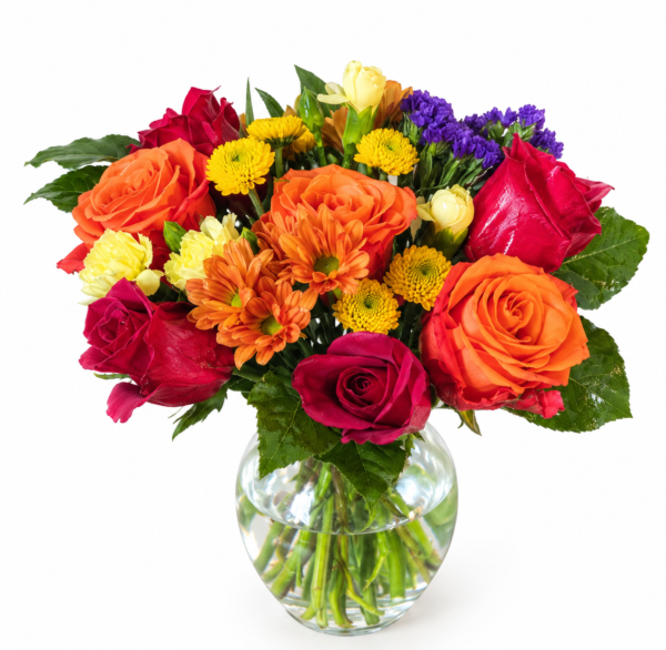 Rainbow Vase bouquet with orange roses, red roses, yellow daisies, purple accents, and lush greenery in a clear glass vase.