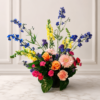 Cincinnati Colorburst bouquet with orange roses, pink gerbera daisies, peach carnations, bright pink mini carnations, yellow snapdragons, blue delphiniums, and purple accents, delivered fresh across Cincinnati and Northern Kentucky by allthepeoplesflowers.com