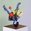 Cincinnati Twilight vase Cincinnati Twilight Vase with roses, lilies, and purple blooms, handcrafted by allthepeoplesflowers.com for delivery in Cincinnati and Northern Kentucky
