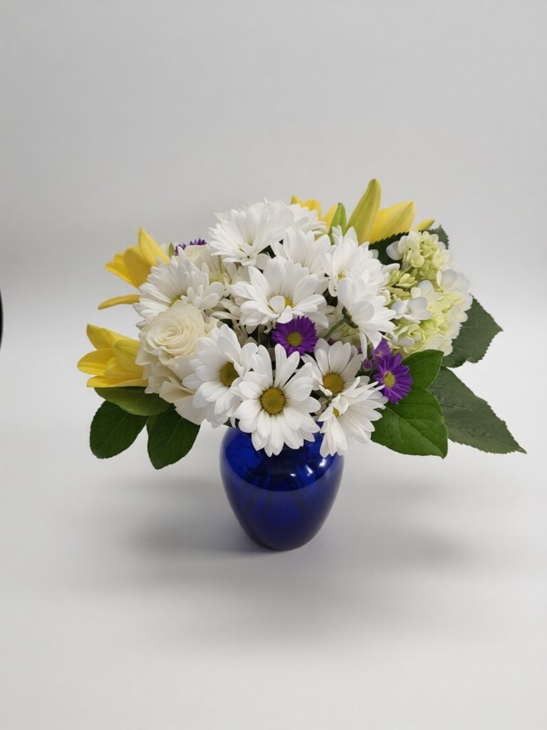 Elegant handcrafted flower arrangement featuring fresh roses, seasonal blooms, and lush greenery, expertly designed by All The People's Flowers for delivery in Cincinnati and Northern Kentucky.