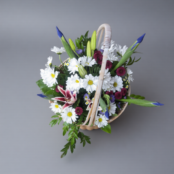 Family Basket of fresh daisies, carnations, lilies, and irises in a wicker basket from Local Cincinnati Florist