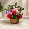 Garden Stroll Basket with roses, carnations, chrysanthemums, button poms, ivy, and fern leaves in a wicker handle arrangement.