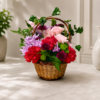 Garden Stroll Basket with roses, carnations, chrysanthemums, button poms, ivy, and fern leaves in a wicker handle arrangement.