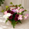 Garden Stroll Basket with roses, carnations, chrysanthemums, button poms, ivy, and fern leaves in a wicker handle arrangement.