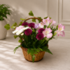 Garden Stroll Basket with roses, carnations, chrysanthemums, button poms, ivy, and fern leaves in a wicker handle arrangement.