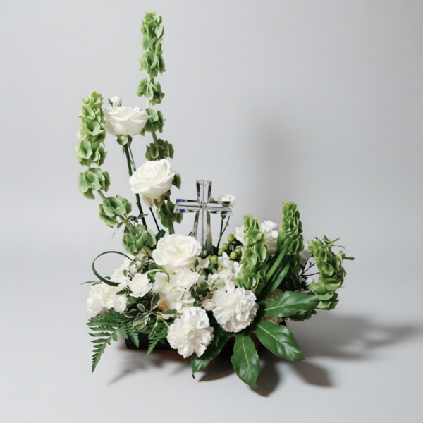 Heaven’s Light Cross floral arrangement with white roses, carnations, greenery, and a crystal cross, delivered fresh across Cincinnati and Northern Kentucky by allthepeoplesflowers.com