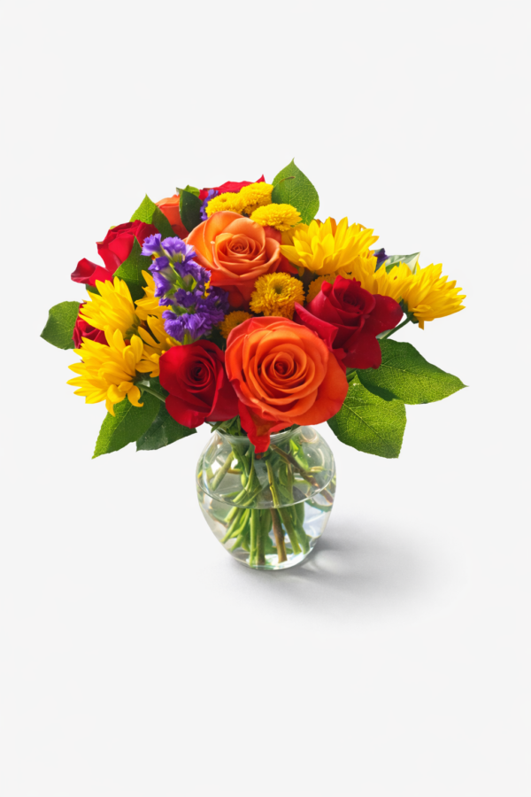 Rainbow Vase bouquet with orange roses, red roses, yellow daisies, purple accents, and lush greenery in a clear glass vase.