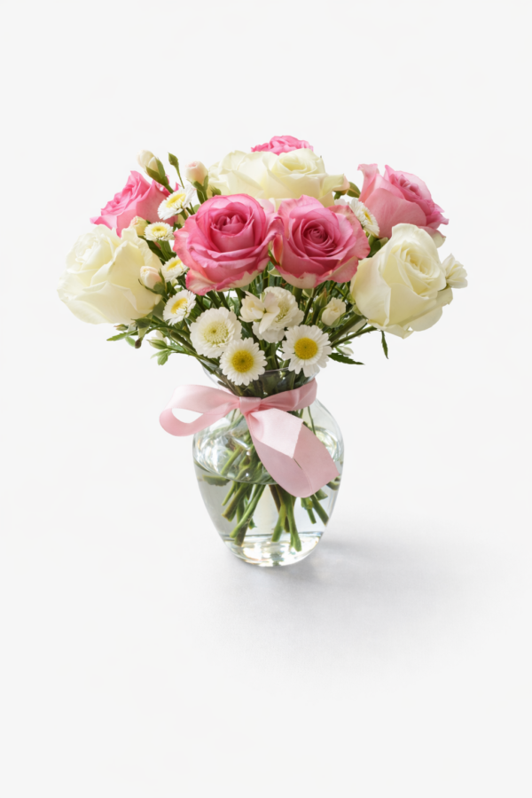 Ribboned Roses bouquet with pink and white roses, daisies, and satin bow in glass vase