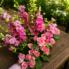 Crazy Beautiful bouquet of pink roses and magenta larkspur with lush greenery, handcrafted for freshness and reliable Cincinnati flower delivery.