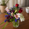 One Woman Man Bouquet featuring chrysanthemum, lemon grass, red rose, pink lily, and purple statice, arranged with fresh, high‑quality flowers and delivered across Cincinnati and Northern Kentucky.