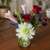 One Woman Man Bouquet featuring chrysanthemum, lemon grass, red rose, pink lily, and purple statice, arranged with fresh, high‑quality flowers and delivered across Cincinnati and Northern Kentucky.