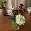 One Woman Man Bouquet featuring chrysanthemum, lemon grass, red rose, pink lily, and purple statice, arranged with fresh, high‑quality flowers and delivered across Cincinnati and Northern Kentucky.