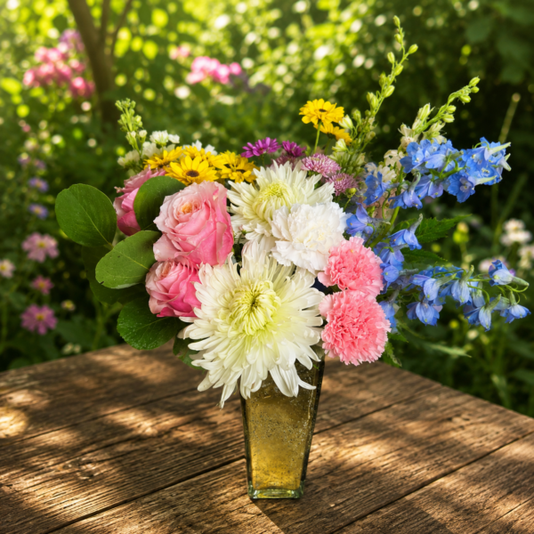 Princess and the Frog bouquet featuring pink roses, carnations, daisies, chrysanthemums, and lush greenery in a whimsical arrangement.