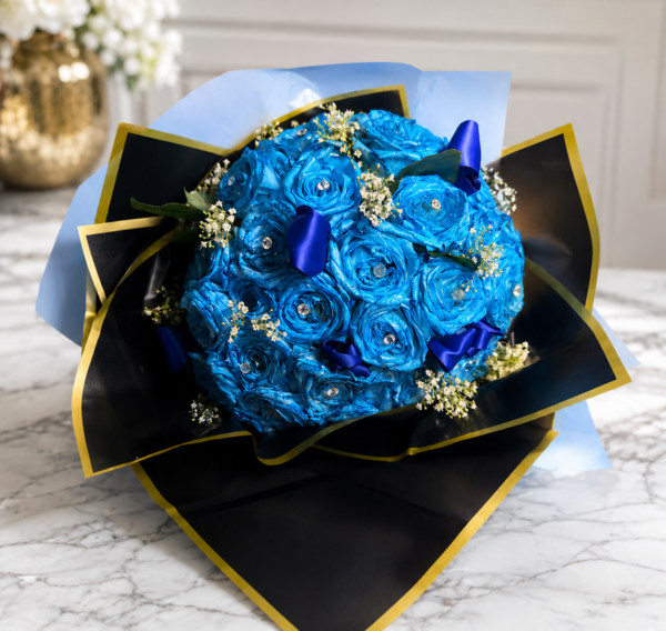 Hollywood Blues bouquet of radiant blue roses with sparkling gems, wrapped in black and gold paper, handcrafted by Cincinnati florist.