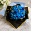 Hollywood Blues bouquet of radiant blue roses with sparkling gems, wrapped in black and gold paper, handcrafted by Cincinnati florist.