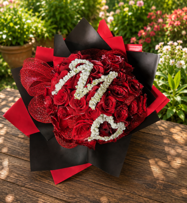 Customized bouquet of 50 red roses with gypsophila embroidery, handcrafted by All the People’s Flowers, local Cincinnati florist.