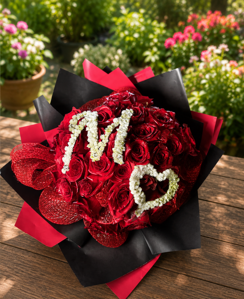 Customized bouquet of 50 red roses with gypsophila embroidery, handcrafted by All the People’s Flowers, local Cincinnati florist.