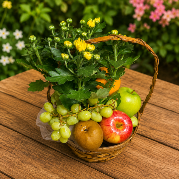 Wicker basket filled with fresh apples, pears, oranges, grapes, and seasonal flowers arranged for a get well gift.