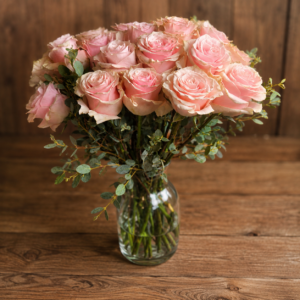 Pink rose bouquet in clear glass vase with lush greenery, handcrafted by All the People’s Flowers for Cincinnati flower delivery.